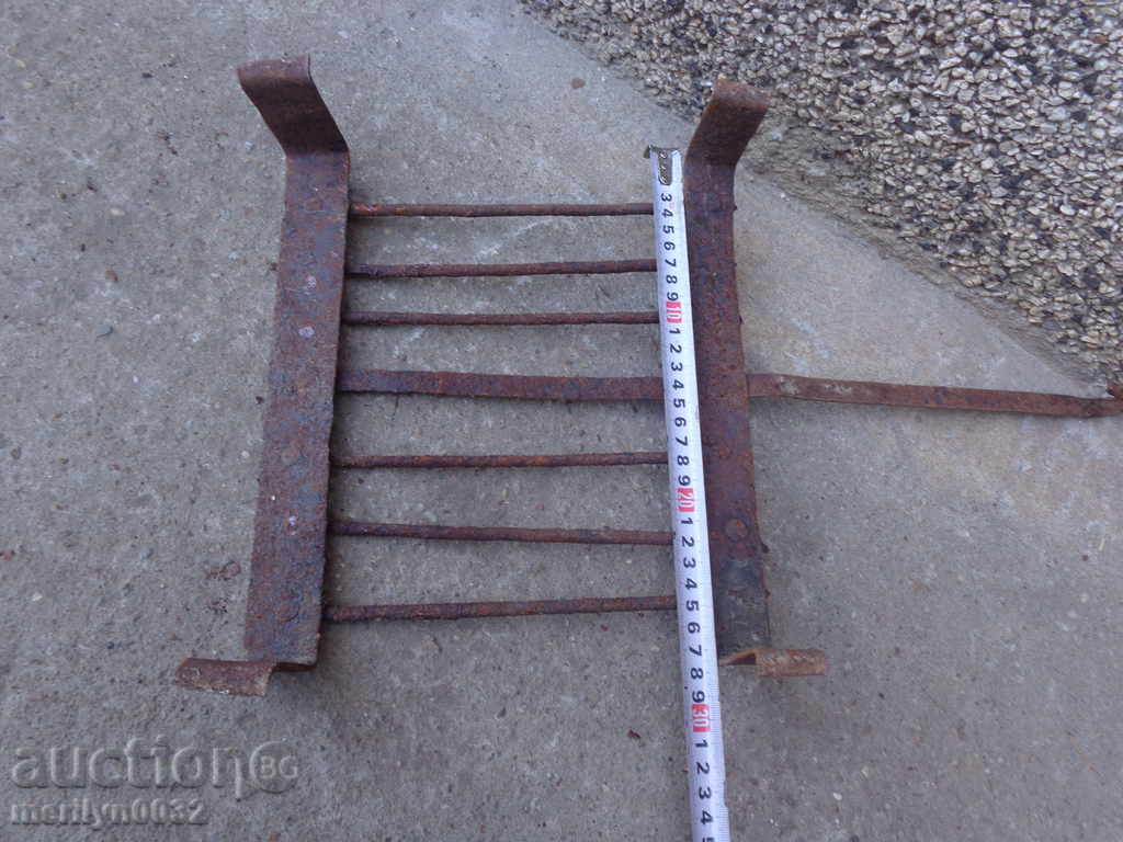 Delivery of An old hand-forged grill, a steak, wrought iron