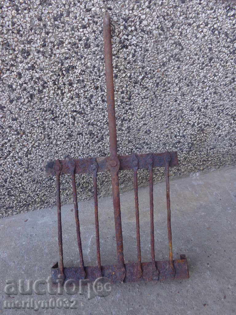 An old hand-forged grill, a steak, wrought iron - 7