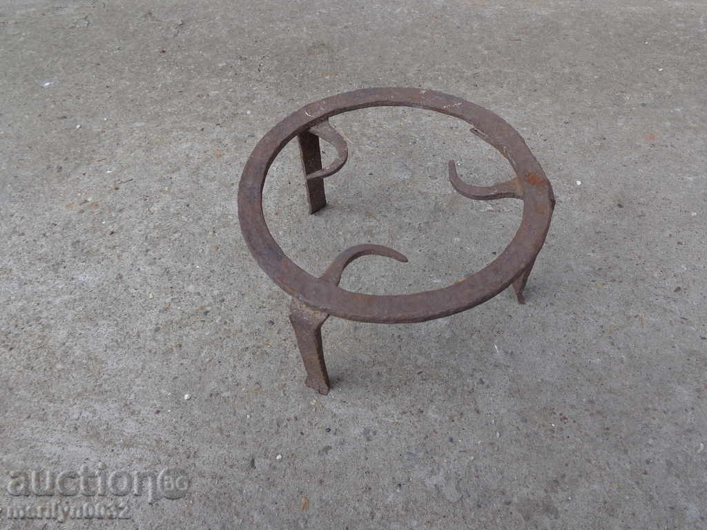 An old forged sack, fireplace, grill, wrought iron An old forged sack, fireplace, grill, wrought iron