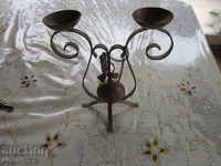 An old candlestick made of copper lamp candle lantern