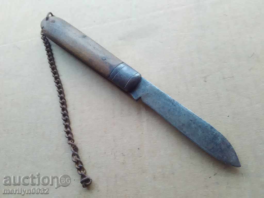 An old knife with wood shavings, a knife, a dagger, a blade