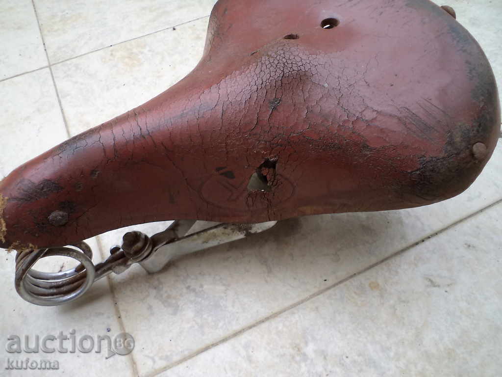 Delivery of 2 old bicycle or motorbike seats