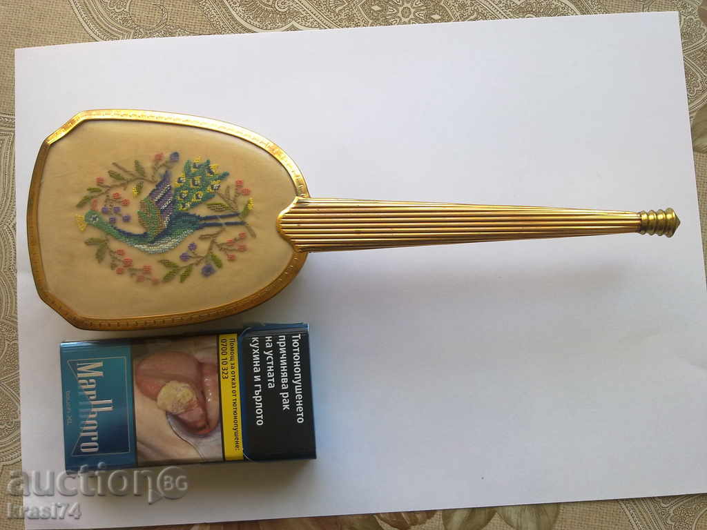 An old gold-plated brush