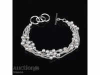 Silver-plated bracelet with charms