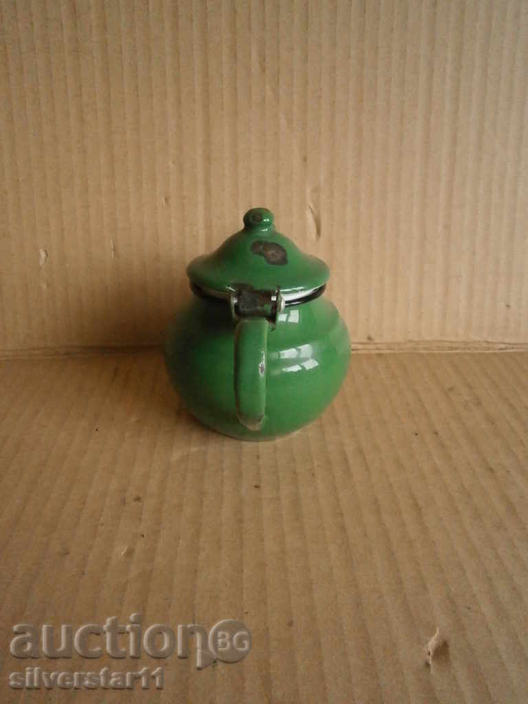 Delivery of a small enamel teapot