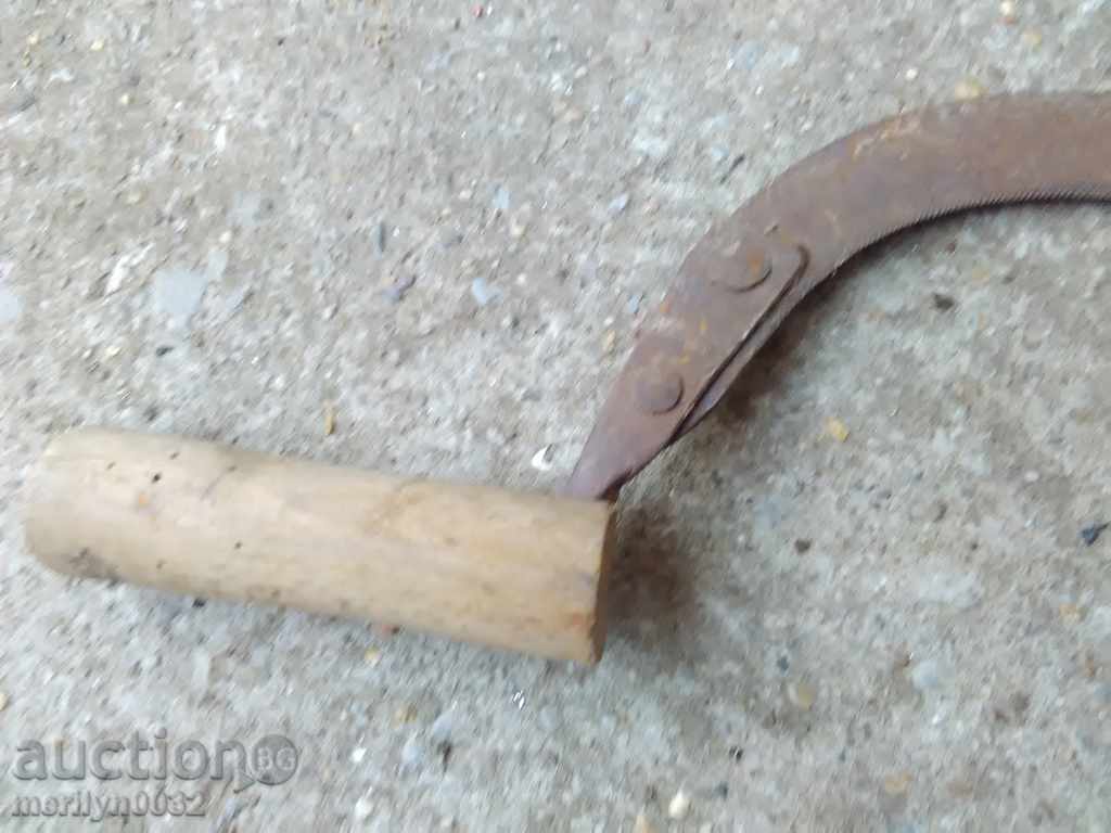 Delivery of An old sickle with a seal, a knife, a blade, a wrought iron Delivery of An old sickle with a seal, a knife, a blade, a wrought iron