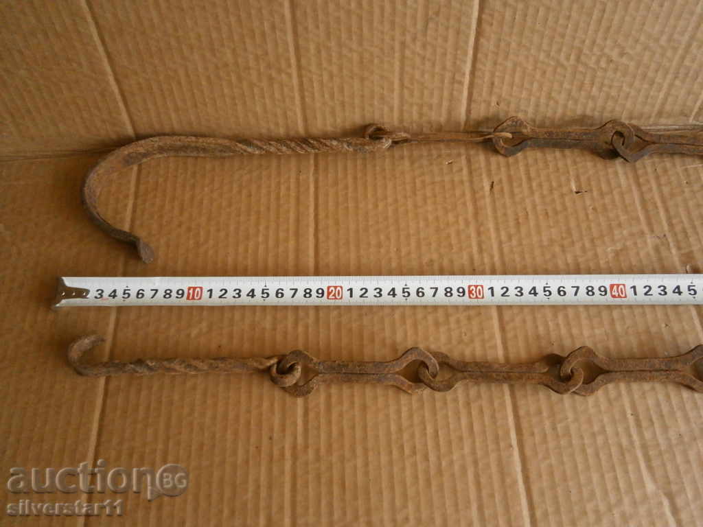 Delivery of Old forged chain with hook, hearth for hearth
