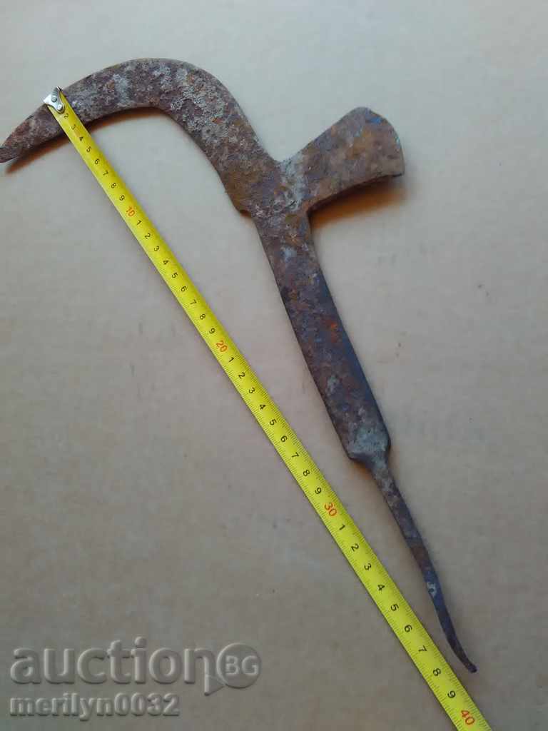 Delivery of An old tool, an instrument, a hand forged cutter, a chopper, a machete Delivery of An old tool, an instrument, a hand forged cutter, a chopper, a machete