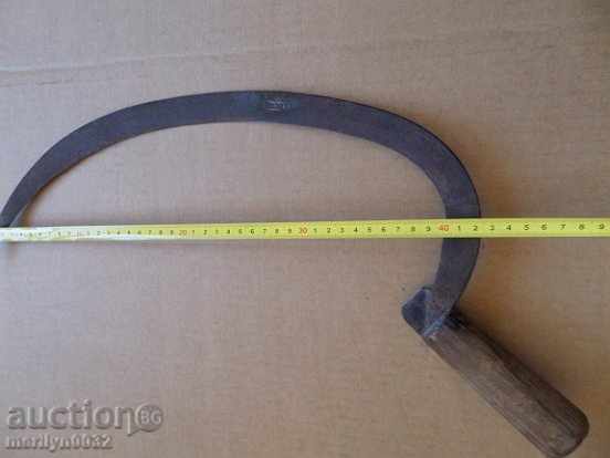 Delivery of An old sickle with a seal, a knife, a blade, a wrought iron Delivery of An old sickle with a seal, a knife, a blade, a wrought iron