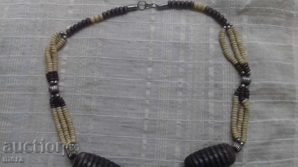 Auction A great exquisite ivory necklace and exotic wood Auction A great exquisite ivory necklace and exotic wood