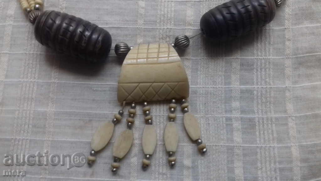 Delivery of A great exquisite ivory necklace and exotic wood Delivery of A great exquisite ivory necklace and exotic wood