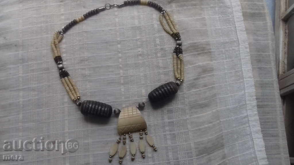 A great exquisite ivory necklace and exotic wood