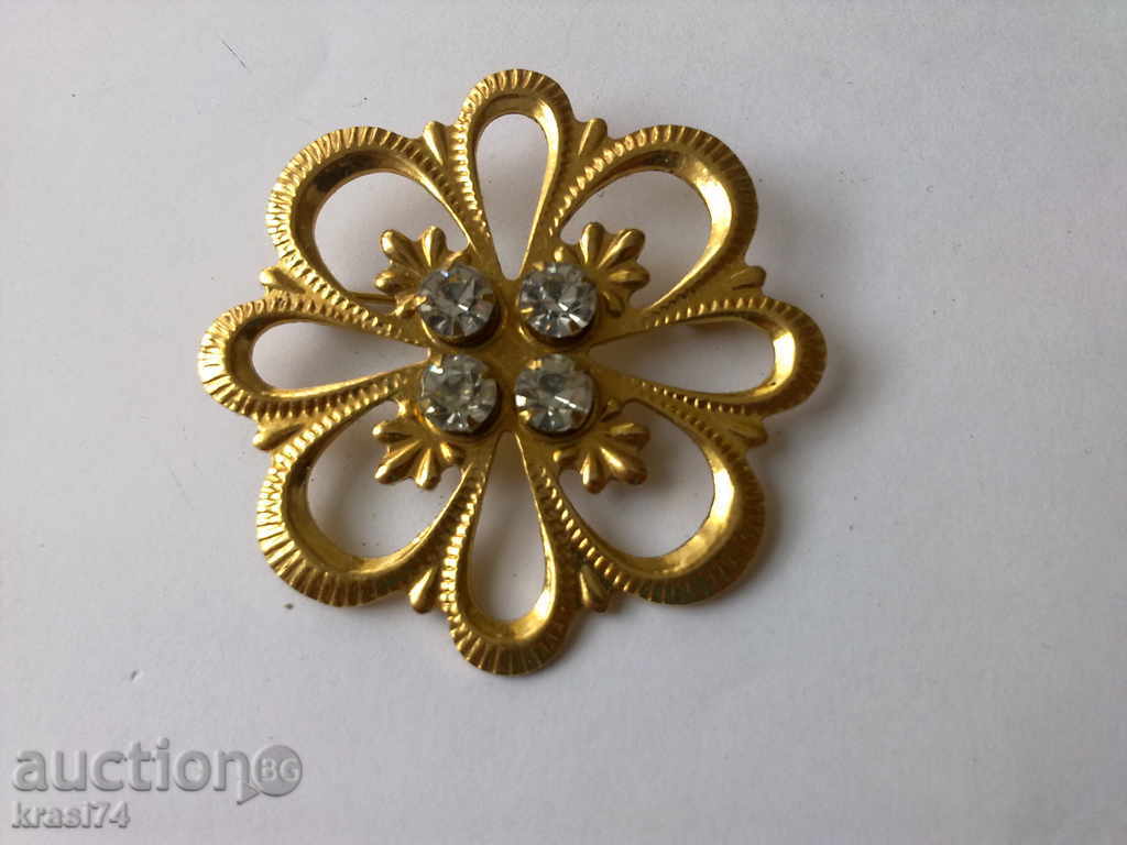 An old, gold-plated, Russian brooch