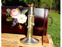 Brass candlestick with beads.