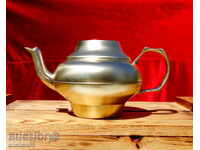 Antique brass kettle.