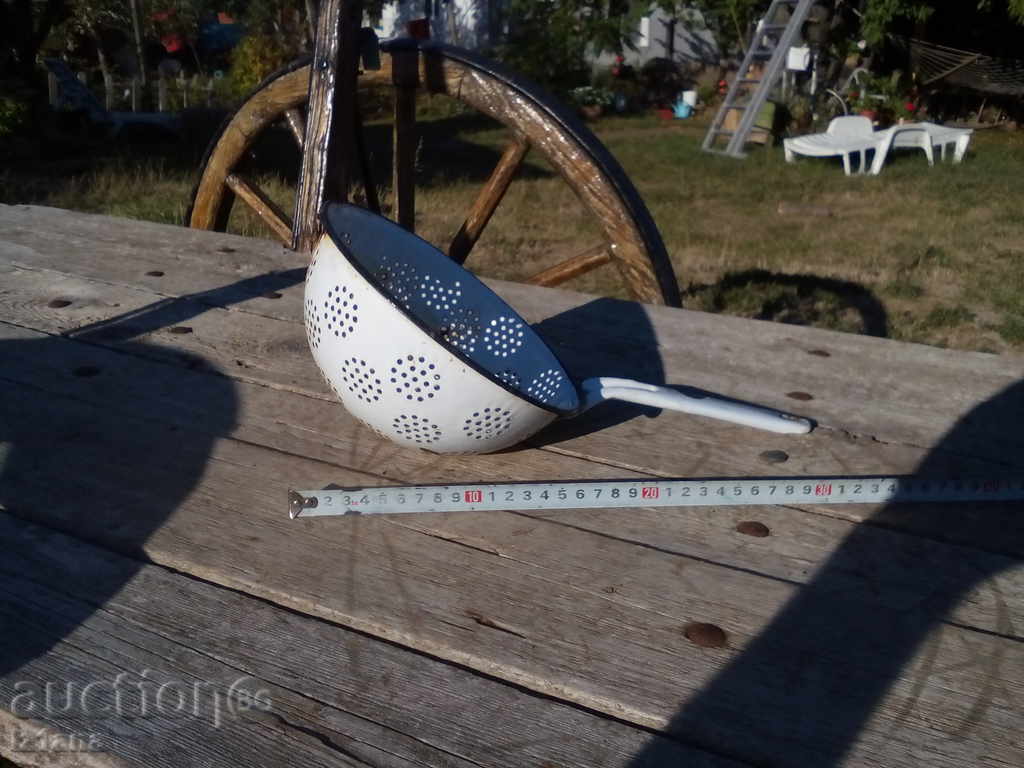 Auction Enamelled colander Auction Enamelled colander