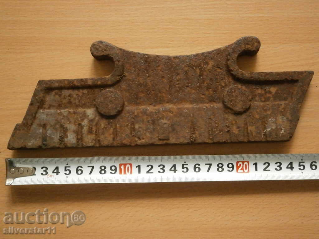 Delivery of cast iron part detail of an ancient fireplace Delivery of cast iron part detail of an ancient fireplace