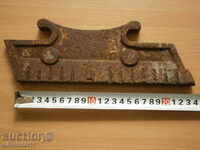 cast iron part detail of an ancient fireplace