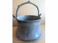 An old copper boiler, a pot, a malt, a baker