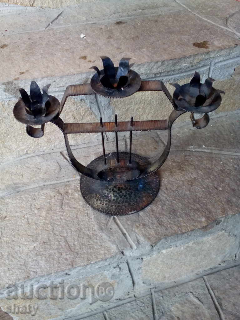 An old forged candlestick.