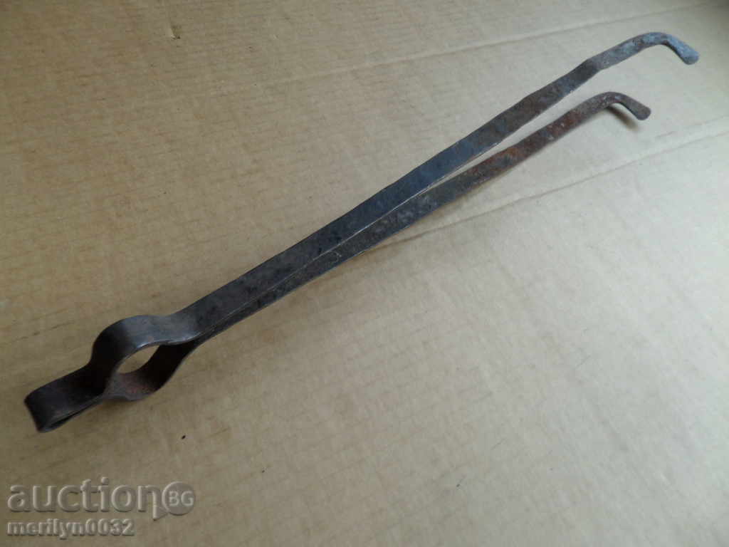 Auction  Old hand forged dilaf, wrought iron, mask