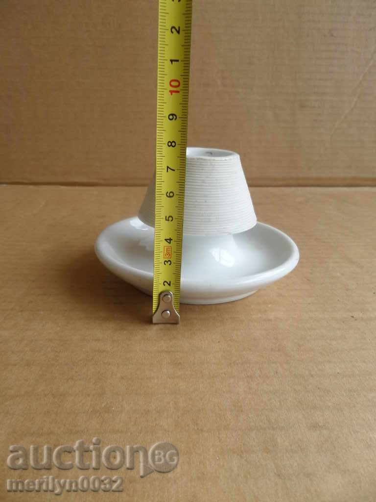 An old porcelain porcelain candlestick with price 39.00 BGN | € 19.94 An old porcelain porcelain candlestick with price 39.00 BGN | € 19.94