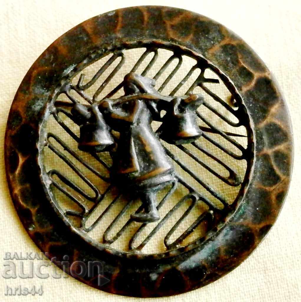 An old copper brooch