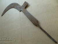 Old instrument picker with engraved wrought iron blade