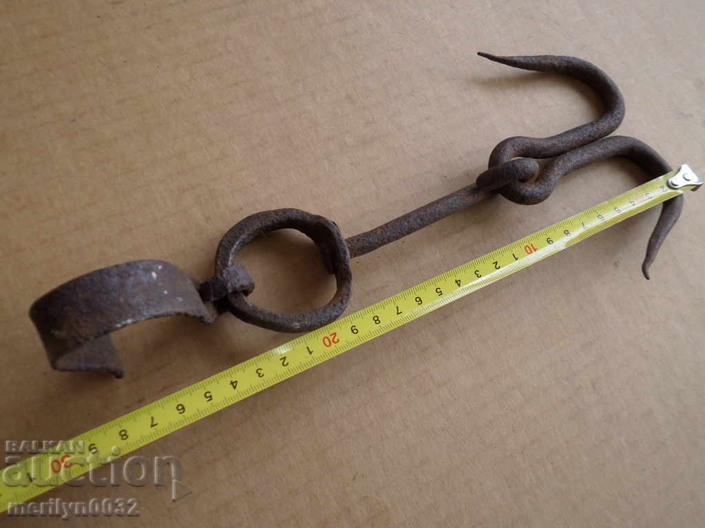 Delivery of An old forged hook for scraping, a cock, anchor Delivery of An old forged hook for scraping, a cock, anchor