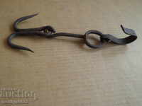 An old forged hook for scraping, a cock, anchor