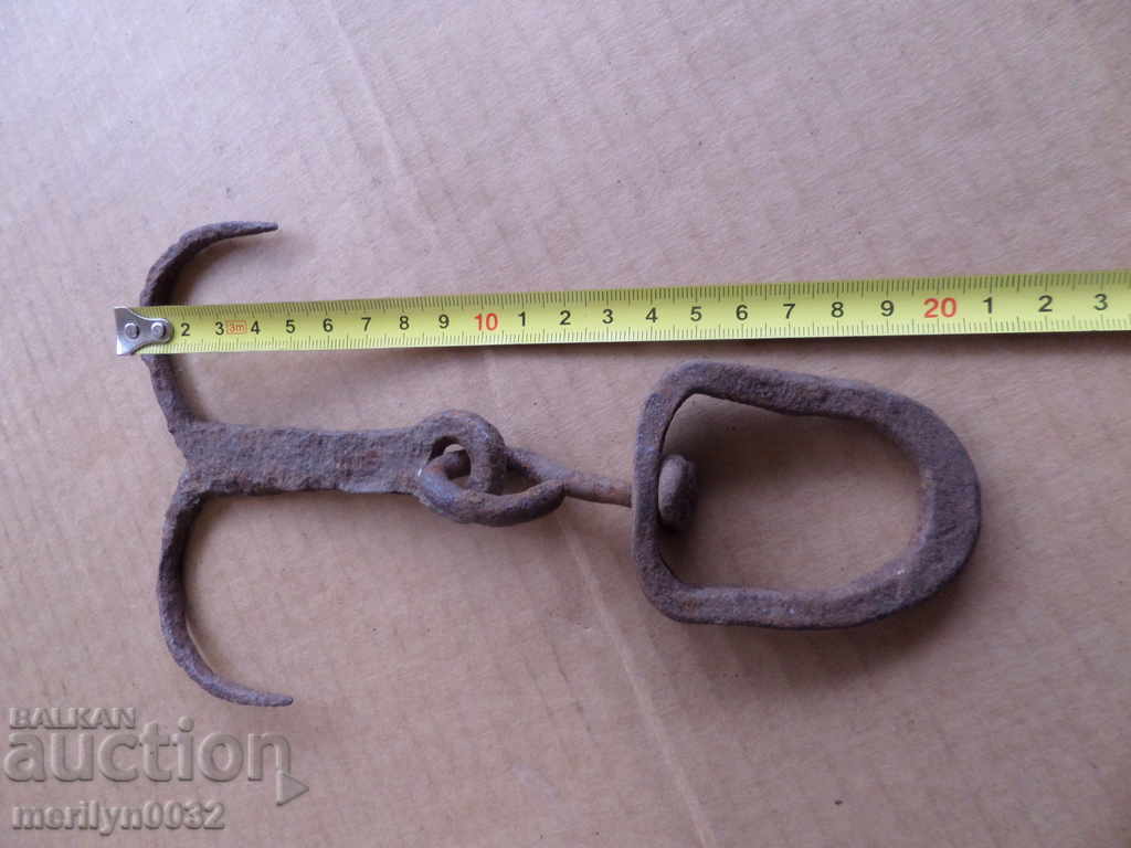 Delivery of An old forged hook for scraping, a cock, anchor Delivery of An old forged hook for scraping, a cock, anchor