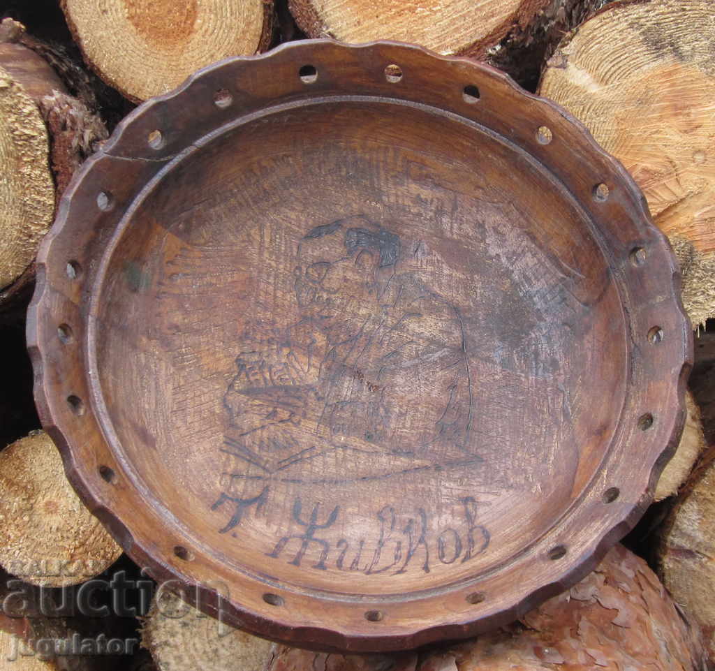 an old wooden plate with a bust of Todor Zhivkov bay Tosho