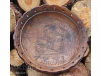 an old wooden plate with a bust of Todor Zhivkov bay Tosho