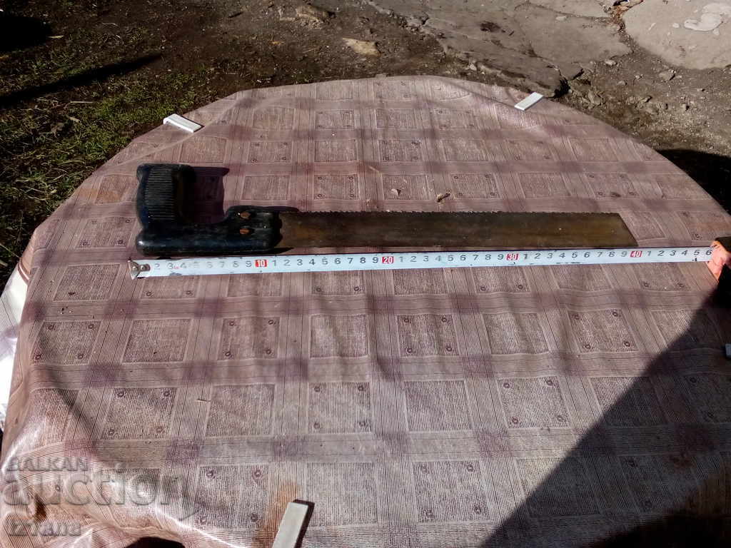 Auction  An old saw, a saw