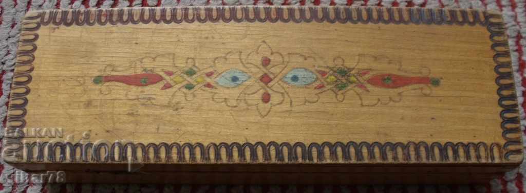 An old wooden pencil box