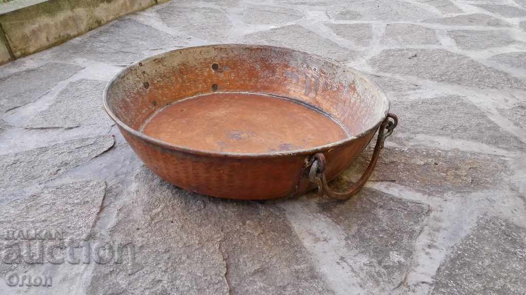 An old wrought copper copper tray