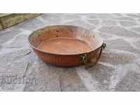 An old wrought copper copper tray