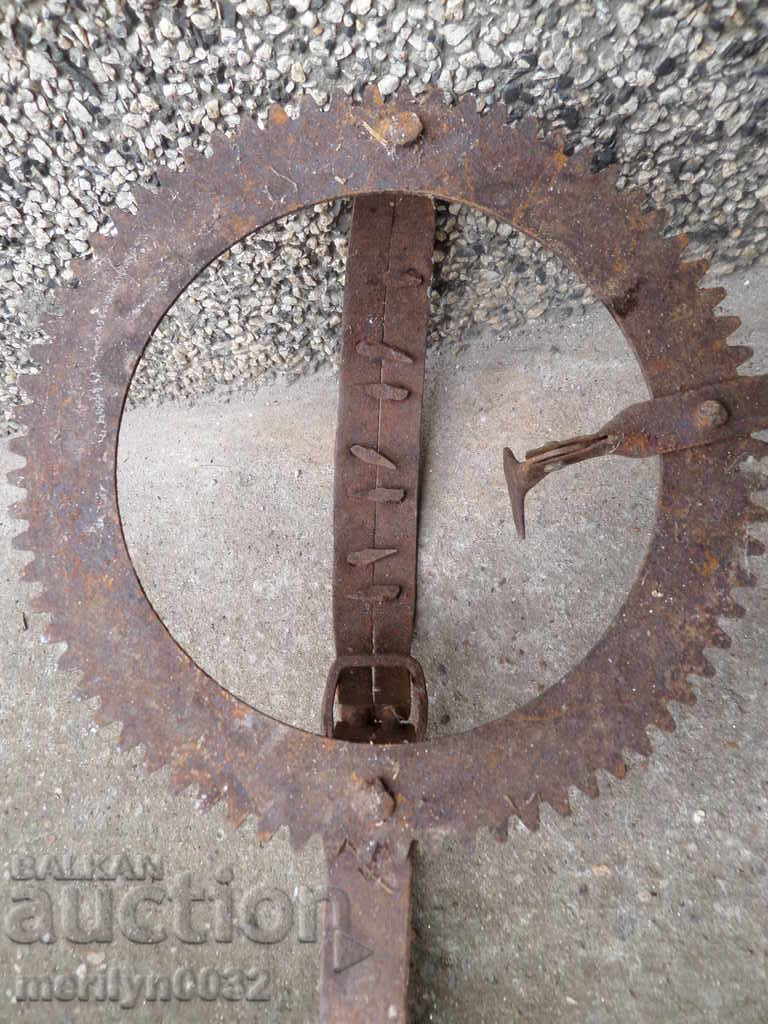 Auction An old hand forged trap with wrought iron spikes Auction An old hand forged trap with wrought iron spikes