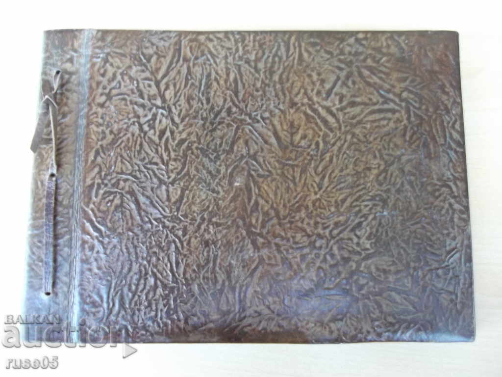 Auction A leather album for photos from the UBB store of Sotsia Auction A leather album for photos from the UBB store of Sotsia