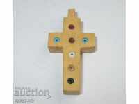 Ancient religious wooden cross with jewelery beads