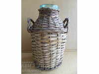 Old rattan jar with a whip wicker bottle