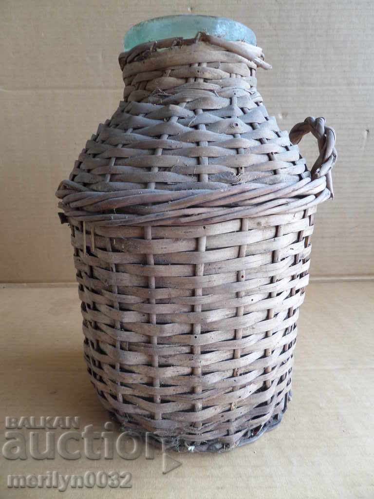 Old rattan jar with a whip wicker bottle