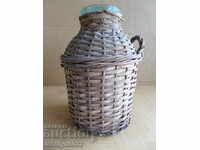 Old rattan jar with a whip wicker bottle