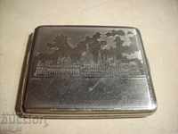 An old metal engraved cigarette case