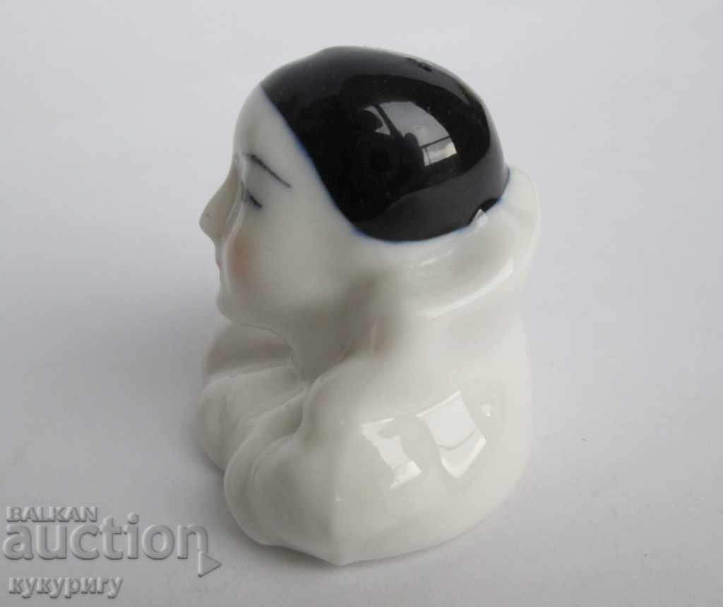 Auction  An old small porcelain statuette figurine Arlequin