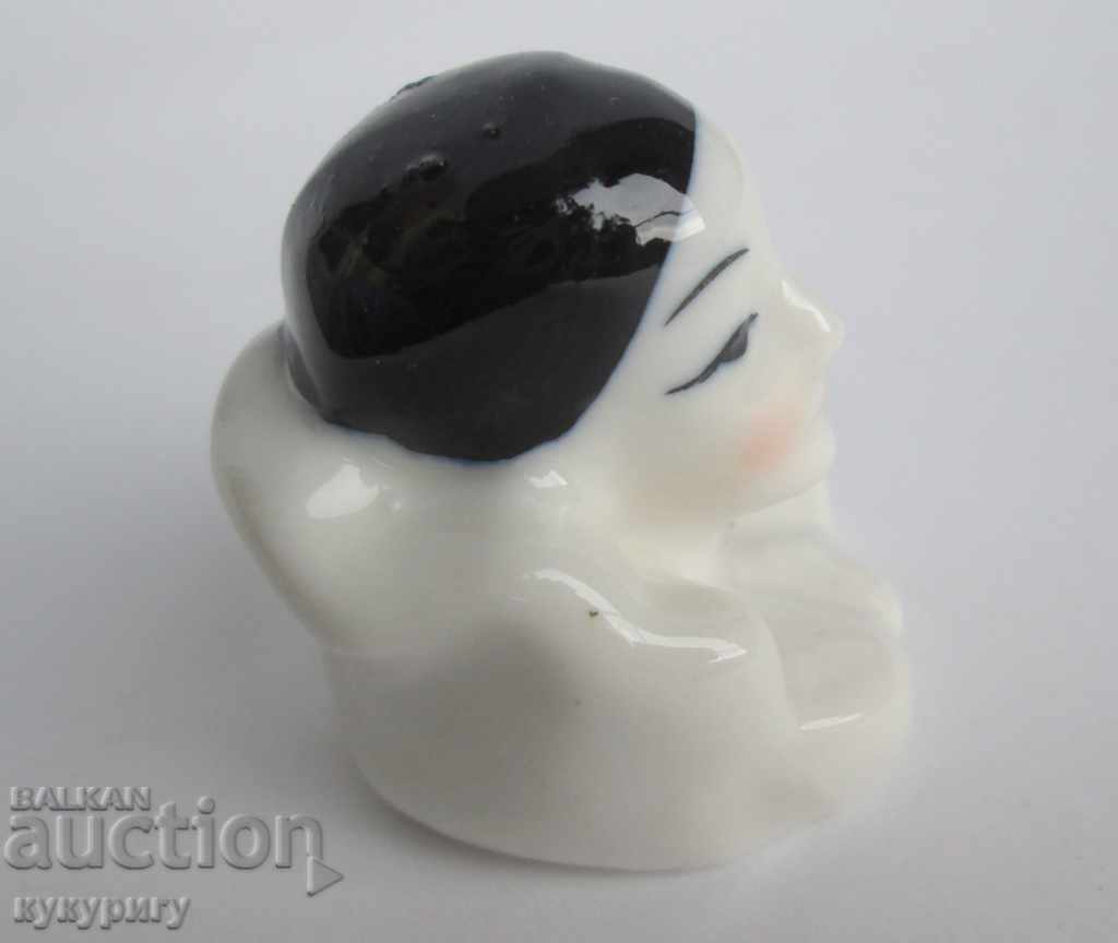 Delivery of An old small porcelain statuette figurine Arlequin