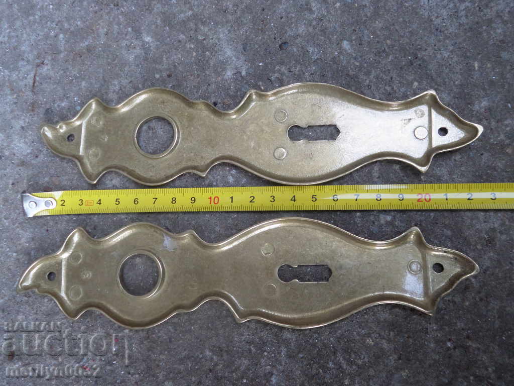 Delivery of Brass fittings for an old lock on a door latch Delivery of Brass fittings for an old lock on a door latch