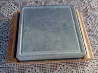 Marble barbecue plate with wooden stand.