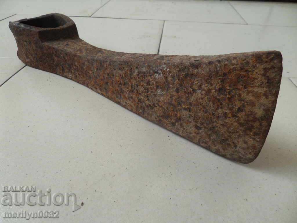 Delivery of An old 170-year-old ax-wrought iron toothed tool Delivery of An old 170-year-old ax-wrought iron toothed tool