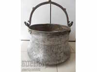 An old copper boiler, a pot, a malt, a baker